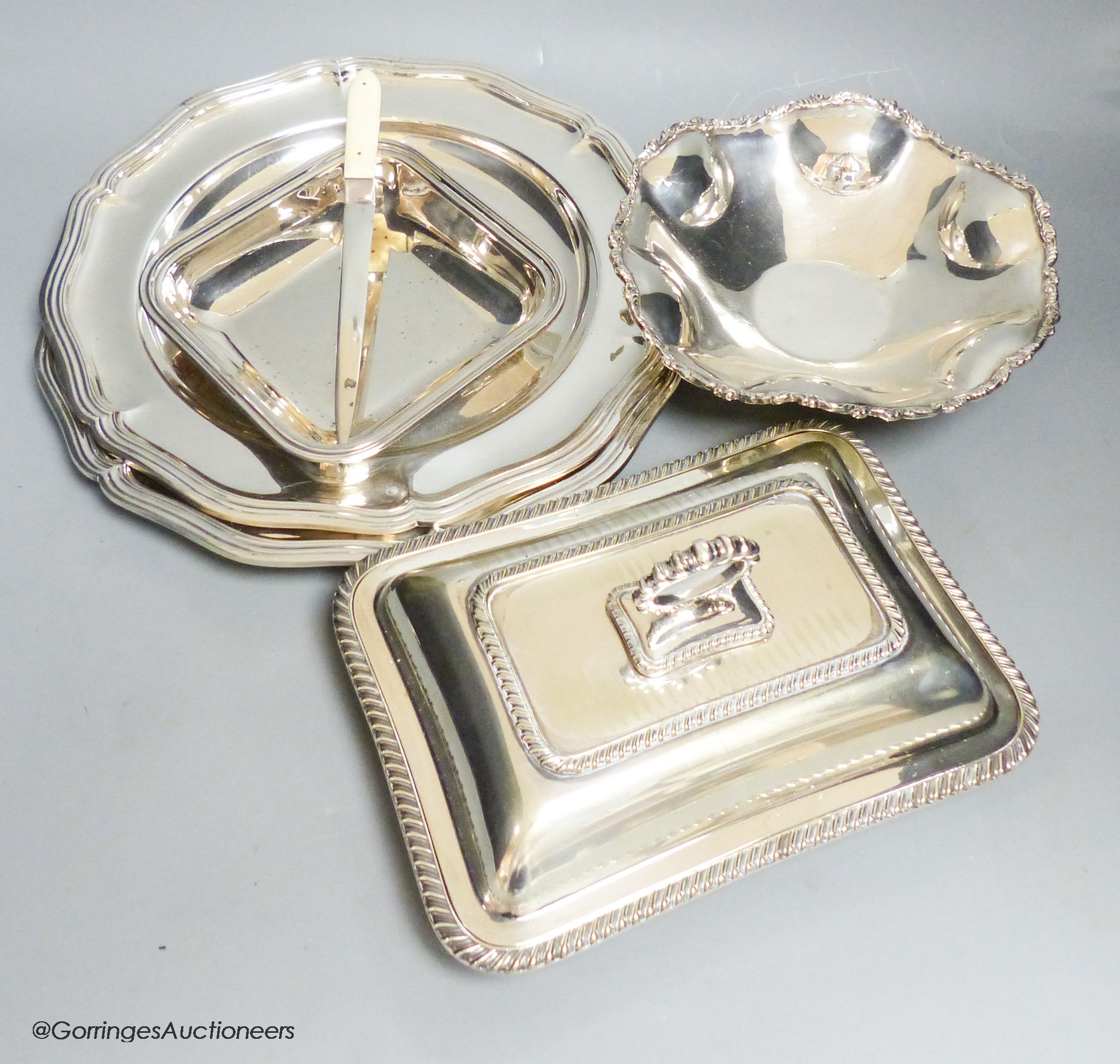 A pair of plated dinner plates, an entree dish and three other items